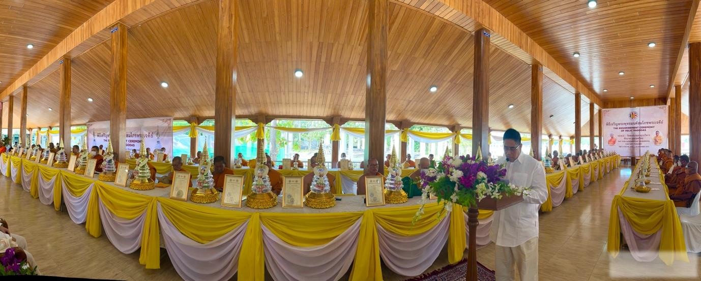 A long table with yellow and white cloth

Description automatically generated